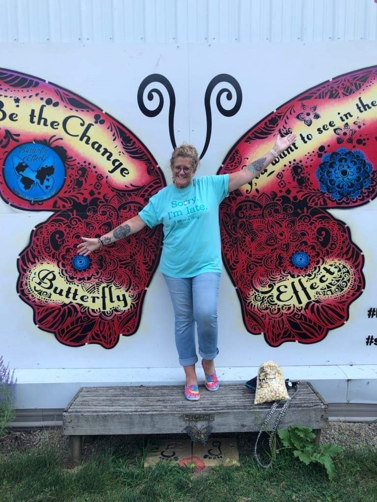 Butterfly mural w Connie by Connie Bootz